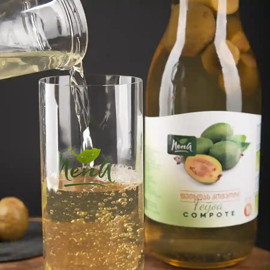 Nena Compote Feijoa - 1 L Feijoa is a fruit you won't find in Czech supermarkets — but once you taste it, you'll understand why Georgians love it. A compote with delicate aromas of pineapple, wild strawberry and mint. A jar of Georgian autumn on your table. Nena Compote Feijoa - 1 L - Image 3